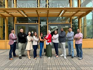 The e+Society Institute core team posing as a group.