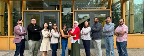 The e+Society Institute core team posing as a group.